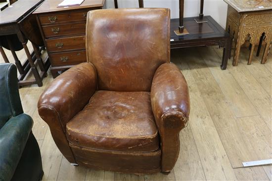 A 1930s French leather club armchair
